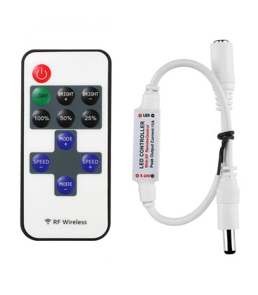 Trådløs dimmer med fjernkontroll som viser knapper for lysstyring og minnefunksjon.