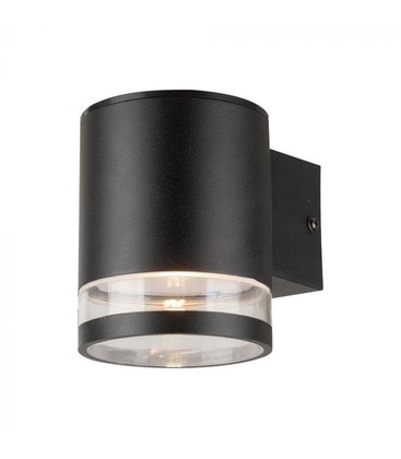 Nærbilde av en kompakt sort solcellevegglampe med integrert solcellepanel på toppen.